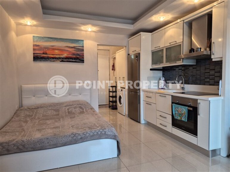 Уютная студия 0+1 в районе Махмутлар с застекленным балконом и видом на горы-id-10781-фото-6