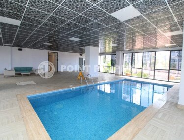 A bright 51 m² apartment in the Mahmutlar area in a complex with hotel infrastructure-id-10784-photo-3