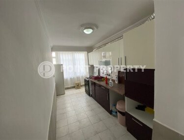 Район Махмутлар, квартира 2+1 площадью 90 м² в комплексе 2000 года постройки, меблированная, расположена в 450 м от моря и в 100 м от центра района.-id-10806-фото-3