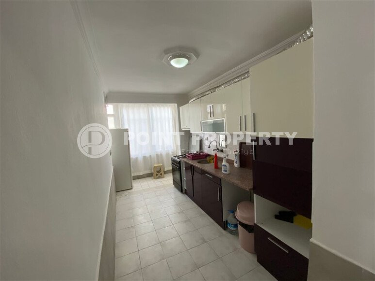 Mahmutlar district, 2+1 apartment, 90 m² in a complex built in 2000, furnished, located 450 m from the sea and 100 m from the center of the district.-id-10806-photo-3