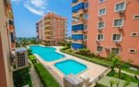 Уютная квартира 120 м² район Махмутлар, рядом с морем, частичный вид на море-id-10848-фото-17