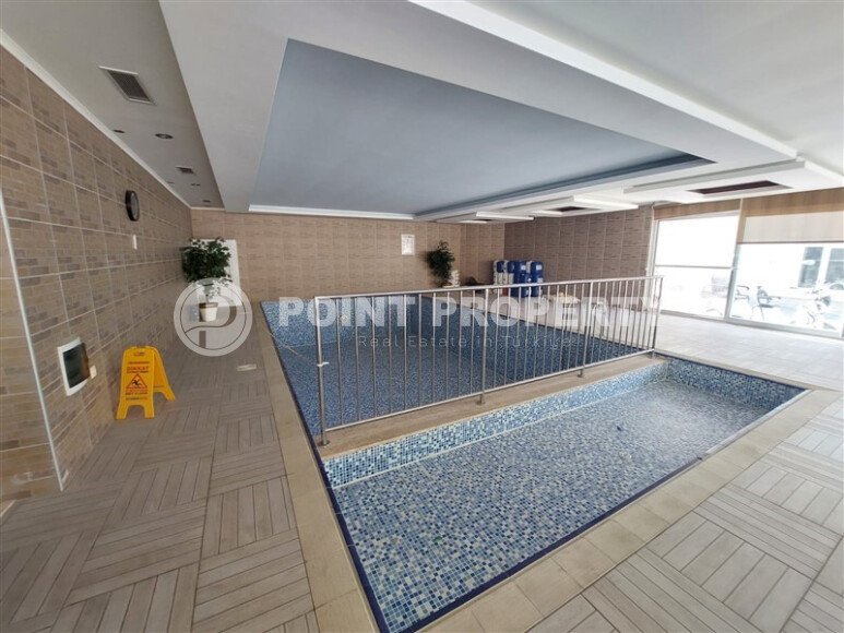 Spacious 65 m² apartment with panoramic windows and views of the green surroundings in Avsallar-id-10916-photo-18