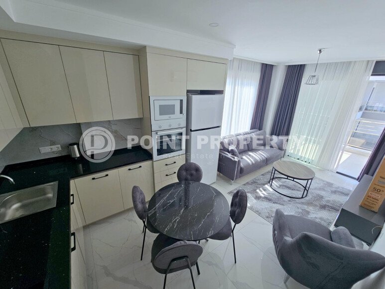 Cozy 1+1 apartment 51 m² in the Oba area with panoramic windows-id-10918-photo-3