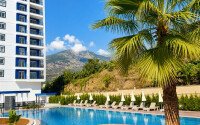 1+1 apartment with an area of 54 m² in a new complex in Mahmutlar-id-10925-photo-1