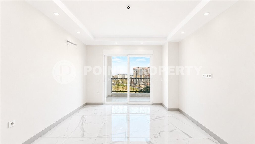 1+1 apartment with an area of 54 m² in a new complex in Mahmutlar-id-10925-photo-2