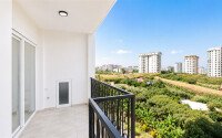 1+1 apartment with an area of 54 m² in a new complex in Mahmutlar-id-10925-photo-7