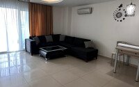 1+1 apartment of 70 m² in Mahmutlar with furniture and a glazed balcony-id-10928-photo-1