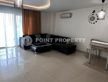1+1 apartment of 70 m² in Mahmutlar with furniture and a glazed balcony-id-10928-photo-1