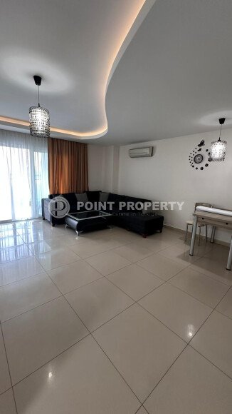 1+1 apartment of 70 m² in Mahmutlar with furniture and a glazed balcony-id-10928-photo-1