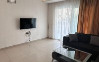 1+1 apartment of 70 m² in Mahmutlar with furniture and a glazed balcony-id-10928-photo-2