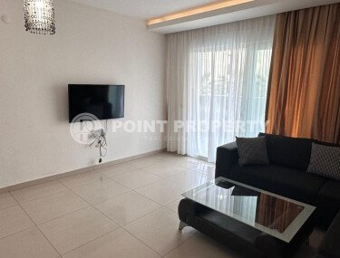 1+1 apartment of 70 m² in Mahmutlar with furniture and a glazed balcony-id-10928-photo-2