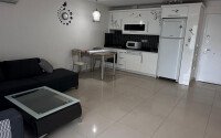 1+1 apartment of 70 m² in Mahmutlar with furniture and a glazed balcony-id-10928-photo-3