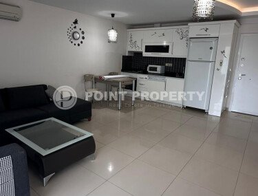 1+1 apartment of 70 m² in Mahmutlar with furniture and a glazed balcony-id-10928-photo-3