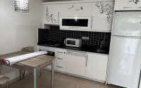 1+1 apartment of 70 m² in Mahmutlar with furniture and a glazed balcony-id-10928-photo-4