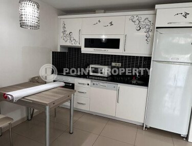 1+1 apartment of 70 m² in Mahmutlar with furniture and a glazed balcony-id-10928-photo-4