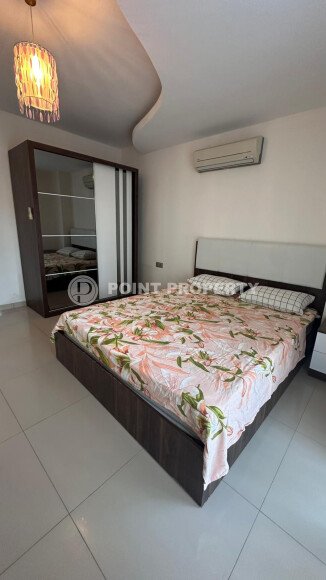 1+1 apartment of 70 m² in Mahmutlar with furniture and a glazed balcony-id-10928-photo-5