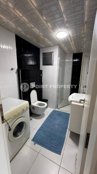 1+1 apartment of 70 m² in Mahmutlar with furniture and a glazed balcony-id-10928-photo-7