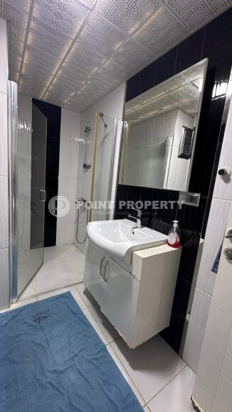 1+1 apartment of 70 m² in Mahmutlar with furniture and a glazed balcony-id-10928-photo-8