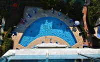 1+1 apartment of 70 m² in Mahmutlar with furniture and a glazed balcony-id-10928-photo-15