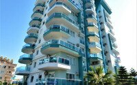 1+1 apartment of 70 m² in Mahmutlar with furniture and a glazed balcony-id-10928-photo-16
