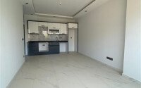 Современная новая квартира 1+1 50 м² в Махмутларе-id-10940-фото-2