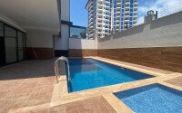 Современная новая квартира 1+1 50 м² в Махмутларе-id-10940-фото-6