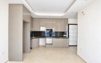 Квартира 58 м² 1+1 в районе Махмутлар-id-10972-фото-2
