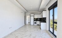 Апартаменты 1+1, 50 м² в районе Демирташ-id-11002-фото-2