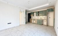 Квартира 1+1 площадью 45 м² с садом 35 м² в районе Махмутлар-id-11019-фото-3