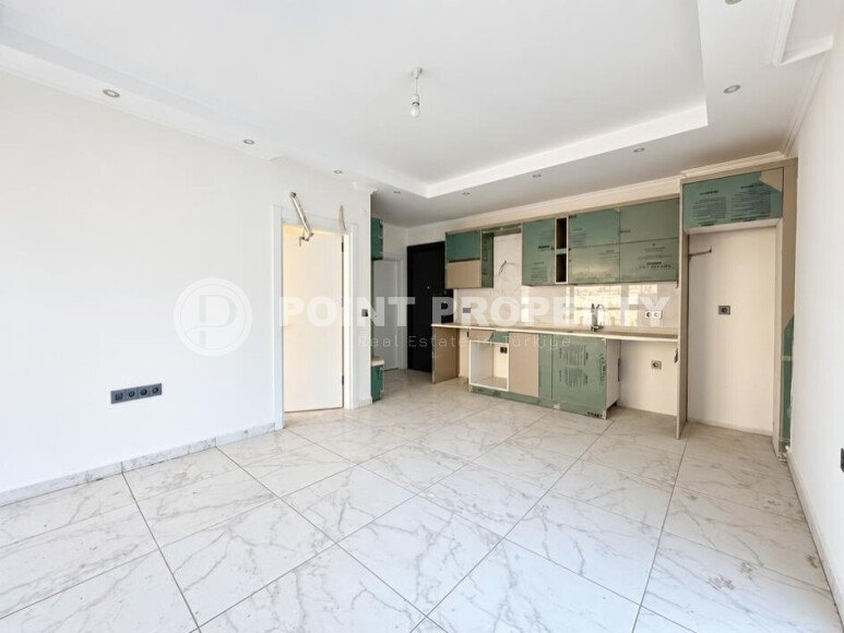 Квартира 1+1 площадью 45 м² с садом 35 м² в районе Махмутлар-id-11019-фото-3