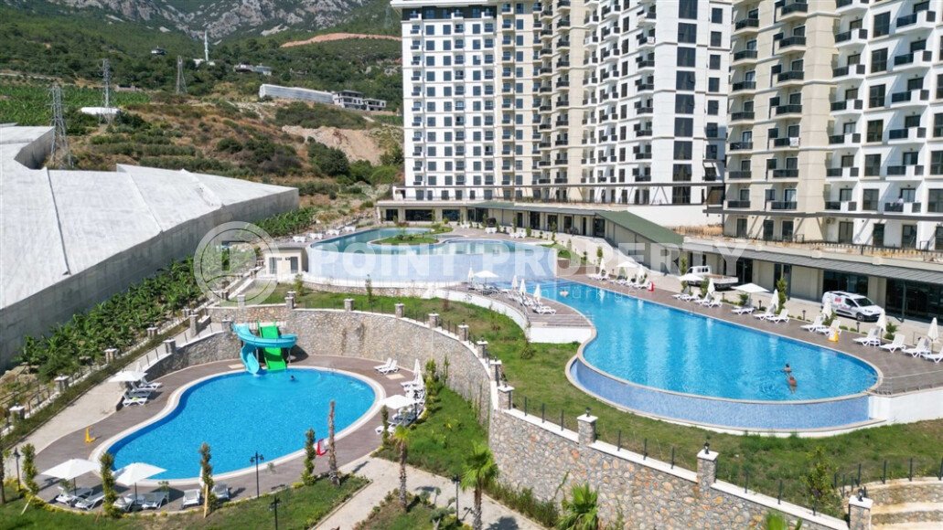 Квартира 1+1 площадью 45 м² с садом 35 м² в районе Махмутлар-id-11019-фото-18