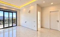 Квартира 1+1 площадью 55 м² в районе Авсаллар, 950 м до моря-id-11032-фото-3